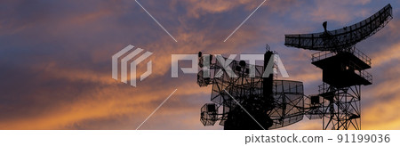 Air defense radars of military mobile anti aircraft systems, modern army industry on the background of the sunset orange sky, Russia 91199036