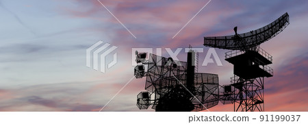 Air defense radars of military mobile anti aircraft systems, modern army industry on the background of the sunset orange sky, Russia 91199037