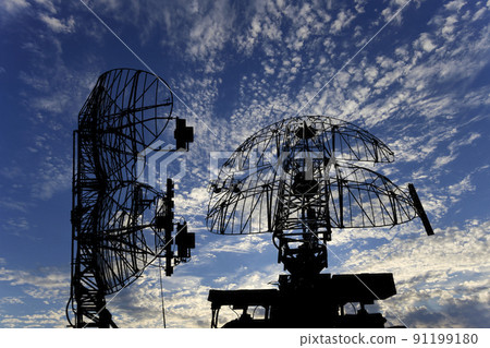 Air defense radars of military mobile anti aircraft systems, modern army industry on background beautiful clouds and sky, Russia 91199180