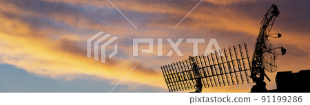 Air defense radars of military mobile anti aircraft systems, modern army industry on the background of the sunset orange sky, Russia 91199286