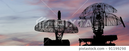Air defense radars of military mobile anti aircraft systems, modern army industry on the background of the sunset orange sky, Russia 91199298