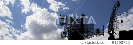 Air defense radars of military mobile anti aircraft systems, modern army industry on background beautiful clouds and sky, Russia 91200793