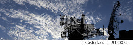 Air defense radars of military mobile anti aircraft systems, modern army industry on background beautiful clouds and sky, Russia 91200794