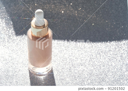 Beige foundation texture swatch. Cream drop with silver sparkles. Face skincare Beige foundation texture swatch. Cream drop with silver sparkles. Face skincare 91201502