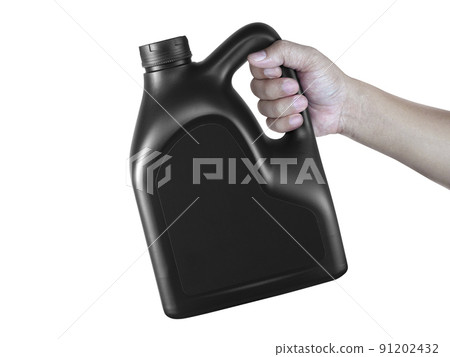 A canister with engine oil in a hand isolated on white background 91202432