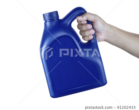 A canister with engine oil in a hand isolated on white background A canister with engine oil in a hand isolated on white background 91202433