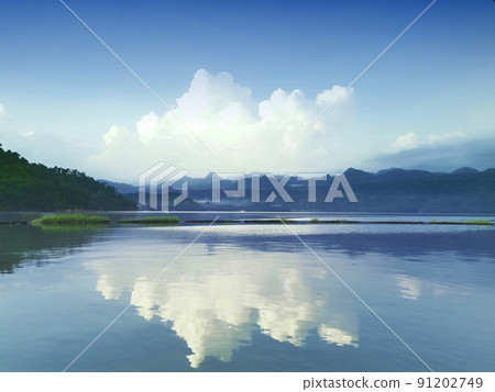 Beautiful natural scenery of river in southeast Asia tropical green forest with mountains in background Beautiful natural scenery of river in southeast Asia tropical green forest with mountains in background 91202749