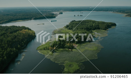 Aerial view of an unknown cargo ship moving between the islands Aerial view of an unknown cargo ship moving between the islands 91206465