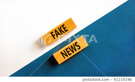 Fake news symbol. Wooden blocks with concept words Fake news on beautiful white and blue background. Business media and fake news concept. Copy space. Fake news symbol. Wooden blocks with concept words Fake news on beautiful white and blue background. Business media and fake news concept. Copy space. 91210196