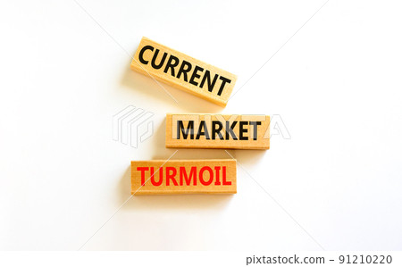 Current market turmoil symbol. Concept words Current market turmoil on wooden blocks on a beautiful white table white background. Business, finacial current market turmoil concept. 91210220