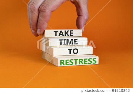 Take time to restress symbol. Concept words Take time to restress on wooden blocks. Beautiful orange table orange background. Psychological business and take time to restress concept. Copy space. 91210243