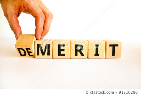 Demerit or merit symbol. Businessman turns wooden cubes and changes the concept word Demerit to Merit. Beautiful white table white background. Business and demerit or merit concept. Copy space. Demerit or merit symbol. Businessman turns wooden cubes and changes the concept word Demerit to Merit. Beautiful white table white background. Business and demerit or merit concept. Copy space. 91210280