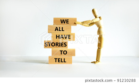 We all have stories to tell symbol. Wooden blocks with words 'We all have stories to tell'. Businessman model. Beautiful white background. Business, popular quotation concept. Copy space. We all have stories to tell symbol. Wooden blocks with words 'We all have stories to tell'. Businessman model. Beautiful white background. Business, popular quotation concept. Copy space. 91210288