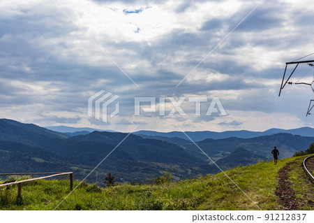 Beautiful panoramic views of the Carpathian Mountains from Uzhotsky pass high peak mountain in Ukrainian Carpathians Mountains. Mountain railway 91212837