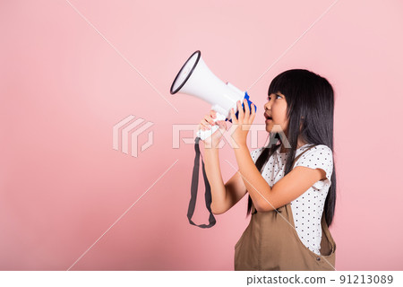 Asian little kid 10 years old shouting by megaphone 91213089