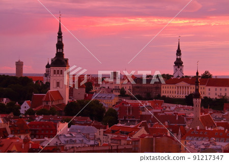 Estonia: The cityscape of Tallinn's old town, a World Heritage Site that retains the sunset sky and the remnants of the Middle Ages 91217347