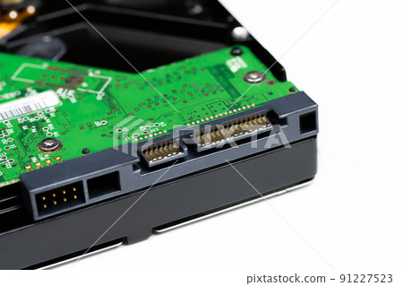 An internal Hardisk drive in 3.5 size isolated on white closed up on the connection. 91227523