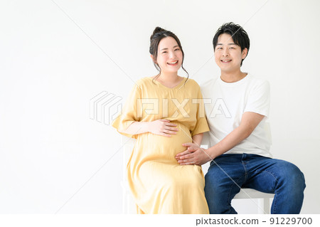 Maternity photo of a happy couple is cute Maternity photo of a happy couple is cute 91229700
