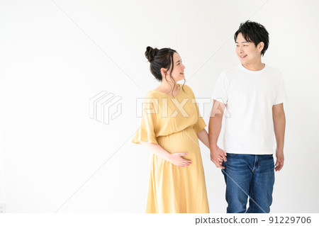 Maternity photo of a happy couple is cute Maternity photo of a happy couple is cute 91229706