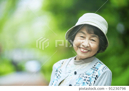 A smiling senior woman standing in the new record A smiling senior woman standing in the new record 91230796