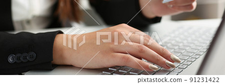 Woman press knobs on keyboard, pay online with credit card, remote shopping on laptop Woman press knobs on keyboard, pay online with credit card, remote shopping on laptop 91231422