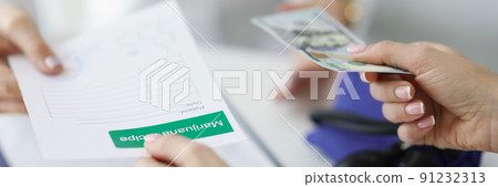 Patient give banknote money to doctor for marijuana recipe in hospital Patient give banknote money to doctor for marijuana recipe in hospital 91232313