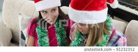 Friends write plans or wishes for next year on empty list 91232352