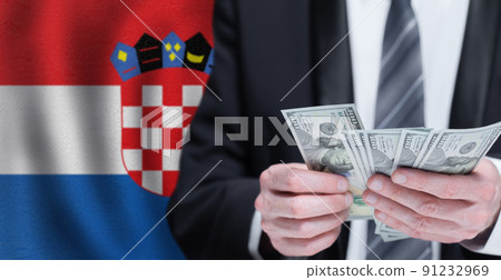 Hands holding dollar money on flag of Croatia 91232969