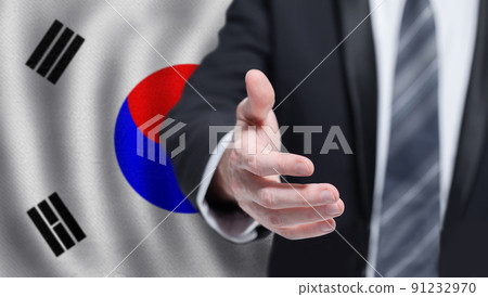 Korean business, politics, cooperation and travel concept. Hand on flag of Korea background. 91232970