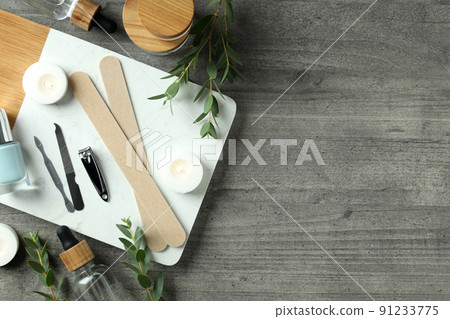 Concept of nail care with manicure accessories on wooden background 91233775