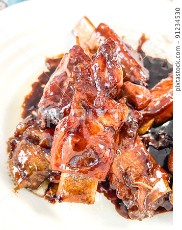 Chinese Shanghai cuisine, red-cooked pork ribs (spare ribs boiled in soy sauce) Chinese Shanghai cuisine, red-cooked pork ribs (spare ribs boiled in soy sauce) 91234530