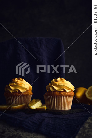 lemon muffins on a dark background 91235463