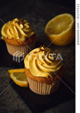 lemon muffins on a dark background lemon muffins on a dark background 91235512