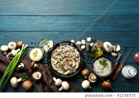 Concept of tasty food with mushroom sauce on wooden background Concept of tasty food with mushroom sauce on wooden background 91236375