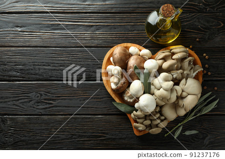 Concept of tasty food with mushrooms on wooden background 91237176