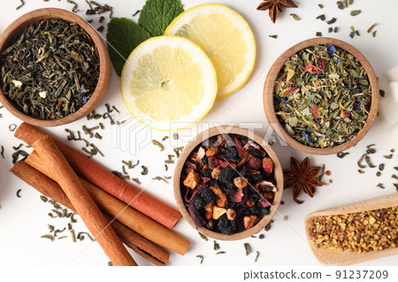 Concept of cooking tea with different types of tea on white background Concept of cooking tea with different types of tea on white background 91237209