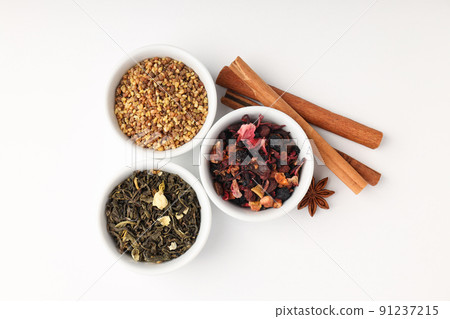 Concept of cooking tea with different types of tea on white background Concept of cooking tea with different types of tea on white background 91237215