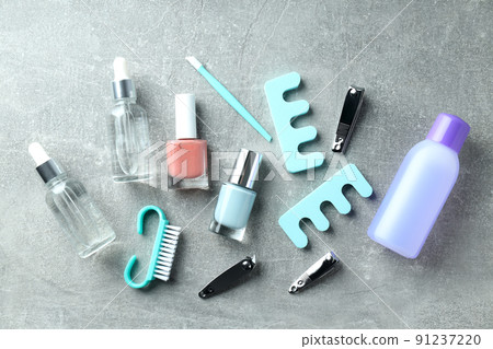 Concept of nail care with manicure accessories on gray textured background 91237220