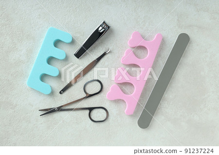 Concept of nail care with manicure accessories on light textured background Concept of nail care with manicure accessories on light textured background 91237224