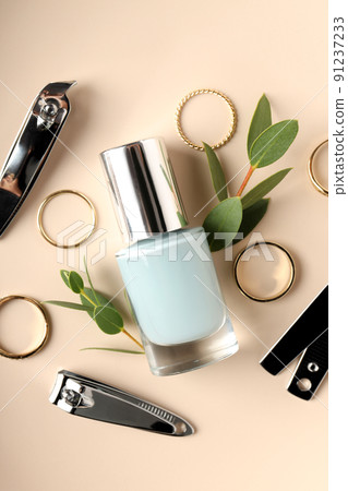 Concept of nail care with manicure accessories on beige background 91237233