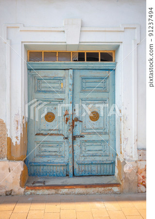 Detailed view of a richly shaped wooden door. 91237494