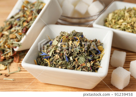 Concept of cooking tea with different types of tea on wooden background 91239458