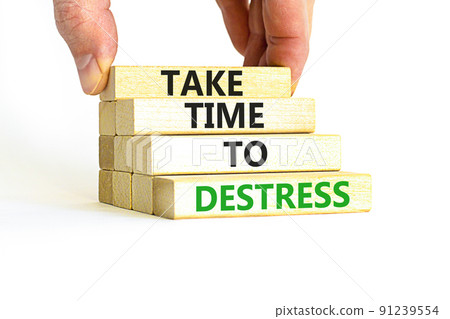 Take time to destress symbol. Concept words Take time to destress on wooden blocks. Beautiful white table white background. Psychological business and take time to destress concept. Copy space. 91239554