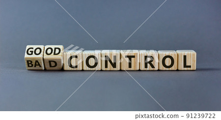 Bad or good control symbol. Turned wooden cubes and changed words 'bad control' to 'good control'. Beautiful grey background. Business and good control concept. Copy space. Bad or good control symbol. Turned wooden cubes and changed words 'bad control' to 'good control'. Beautiful grey background. Business and good control concept. Copy space. 91239722