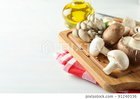 Concept of cooking with mushroom on white wooden 91240336