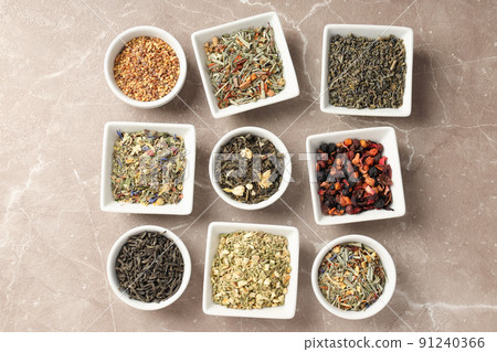 Flat lay with different types of tea on textured background 91240366
