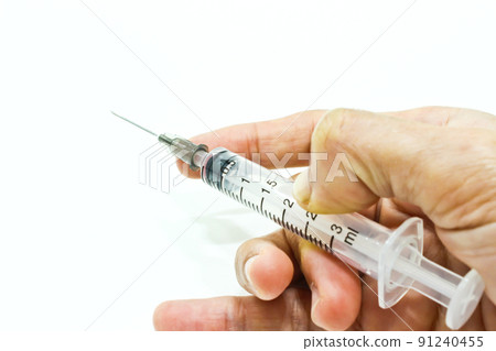 Hand Hold 3 ml Plastic Syringe Isolated on the White Background Hand Hold 3 ml Plastic Syringe Isolated on the White Background 91240455