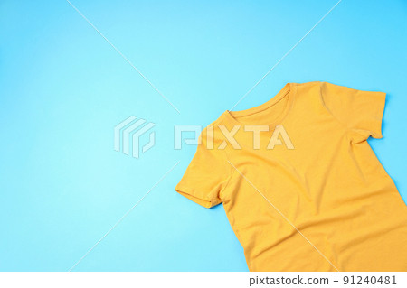 Blank yellow t-shirt with space for print on blue background Blank yellow t-shirt with space for print on blue background 91240481