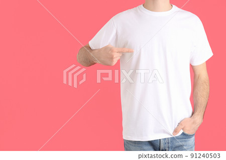 Man in blank white t-shirt on pink background 91240503
