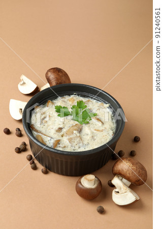 Concept of tasty food with mushroom sauce on beige background 91240561